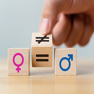 A hand flips a wooden block between 